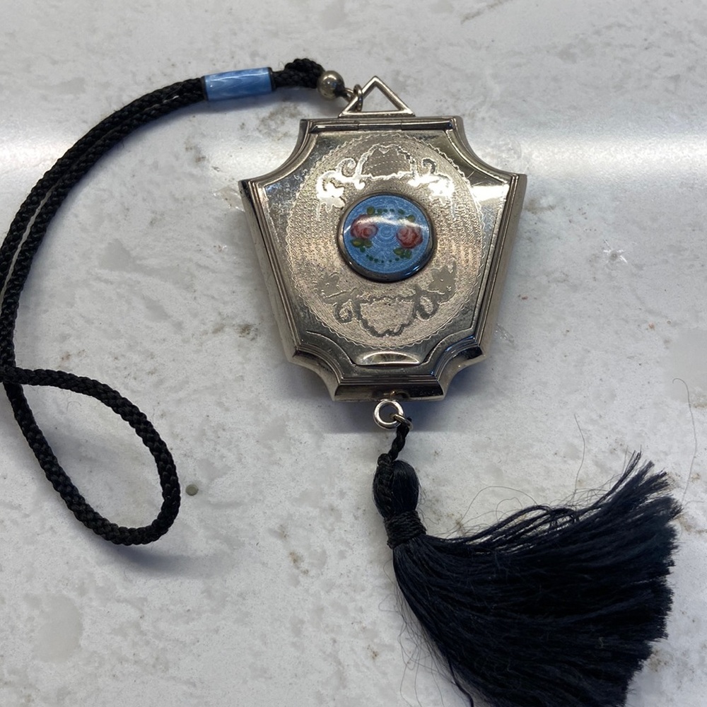 Guilloche ladies hand compact with face powder.